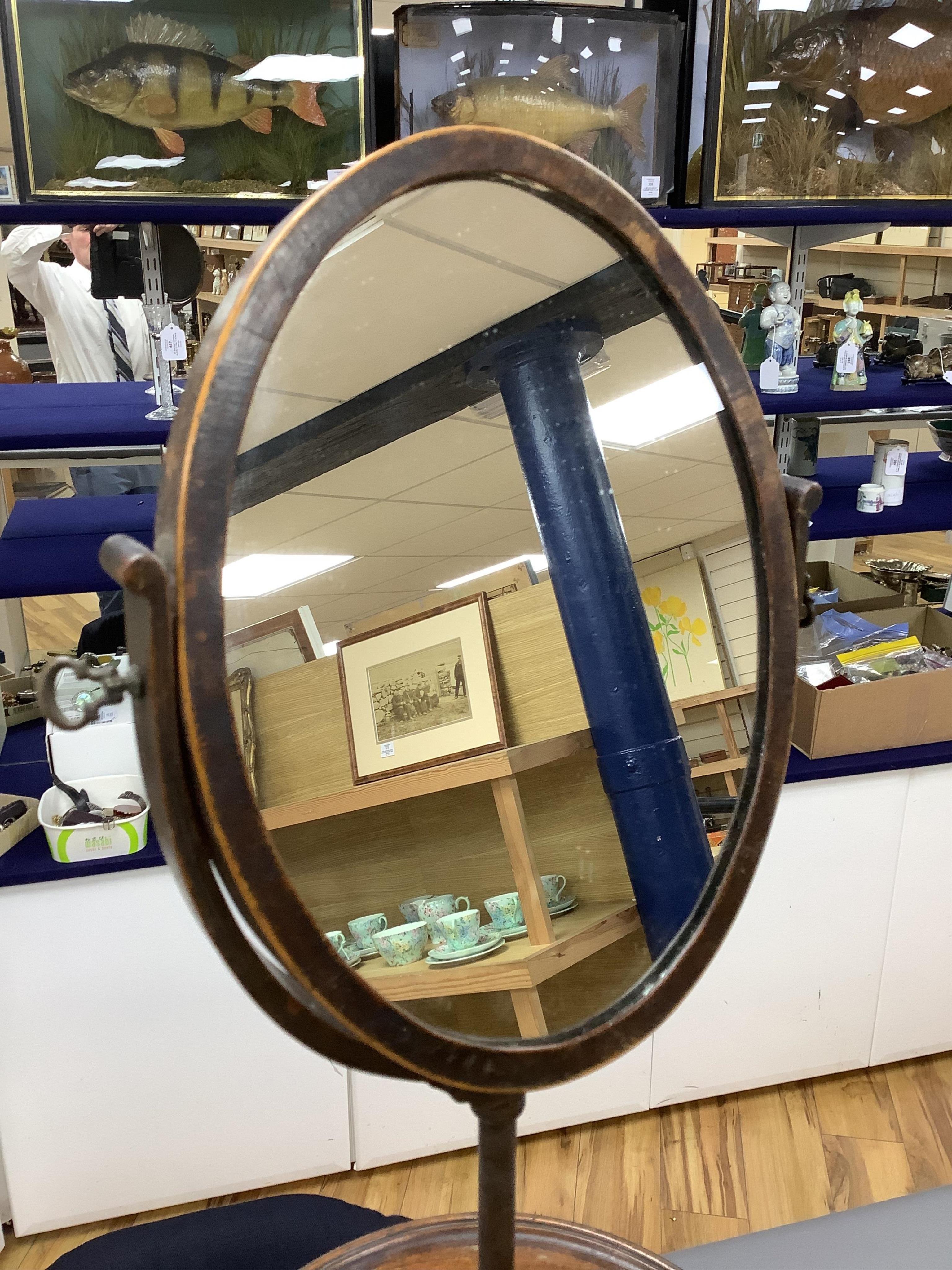 A Victorian mahogany gentleman's shaving mirror on stand with circular shelf, 65cm high.
